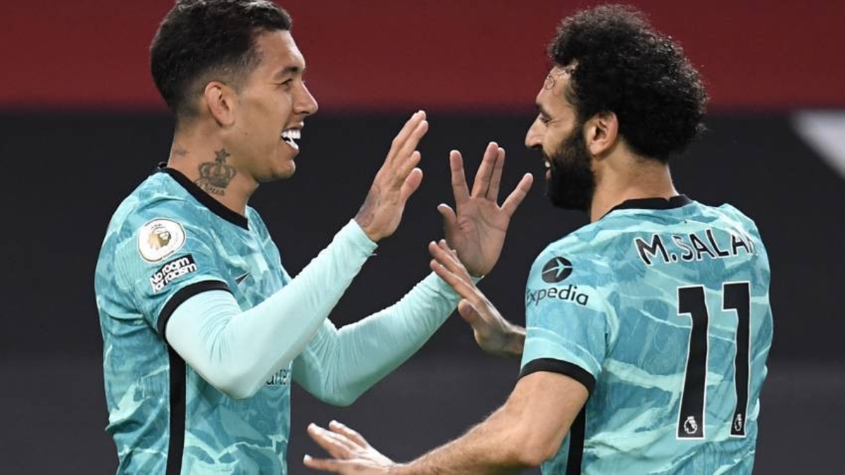 Liverpool forwards Roberto Firmino (left) and Mohamed Salah